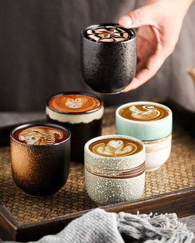 Bali Barista coffee mugs presented on a wooden table with a grey background