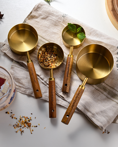 Kitchen utensils measuring spoons barista bartending restaurant cooking fine dining elevated luxurious gold silver wooden