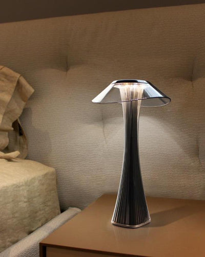 Lamp with the shape of a mushroom made of glass in a bedroom stand
