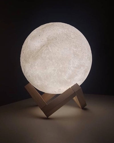Desk lamp in moon shape on a wooden base