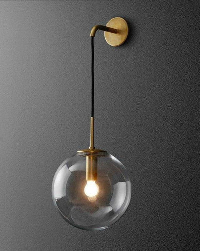 Nordic Wall lamp made of bronze and gold hanging on a gray wall