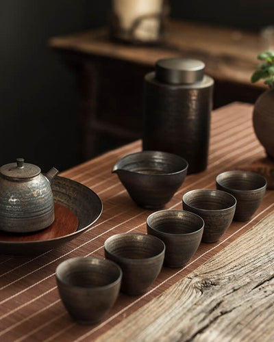 ZEN Shibuya tea cups presented on a wooden table next by a tea pot and a small tree
